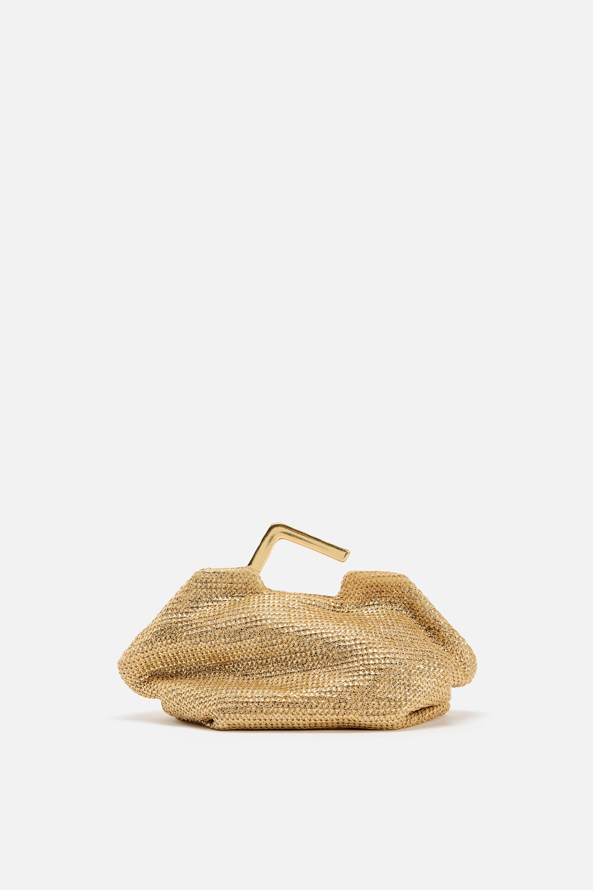 GOLD BAG WITH METAL HANDLE