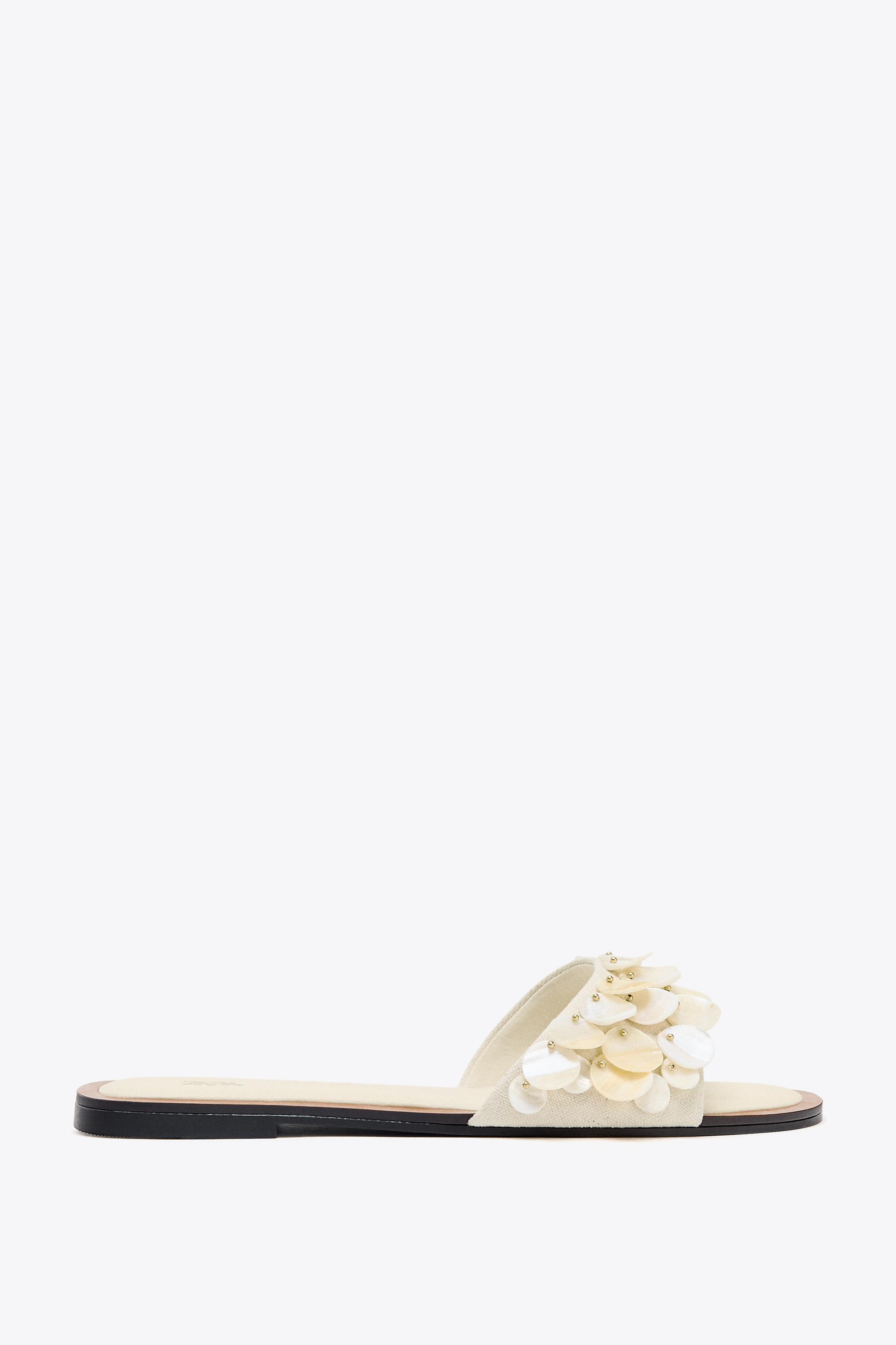FLAT SANDALS WITH PEARLESCENT PIECES