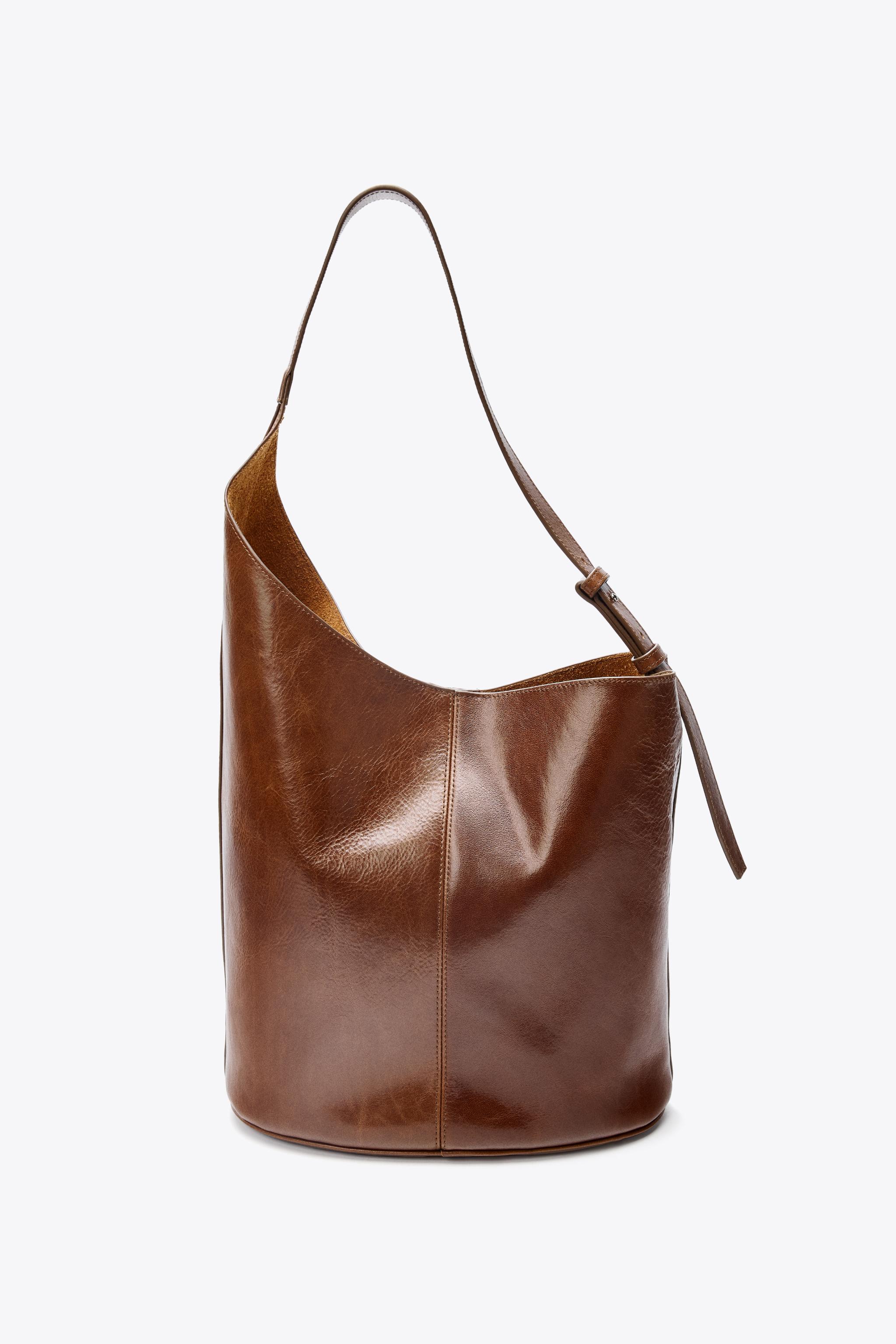 ASYMMETRIC LEATHER BUCKET BAG