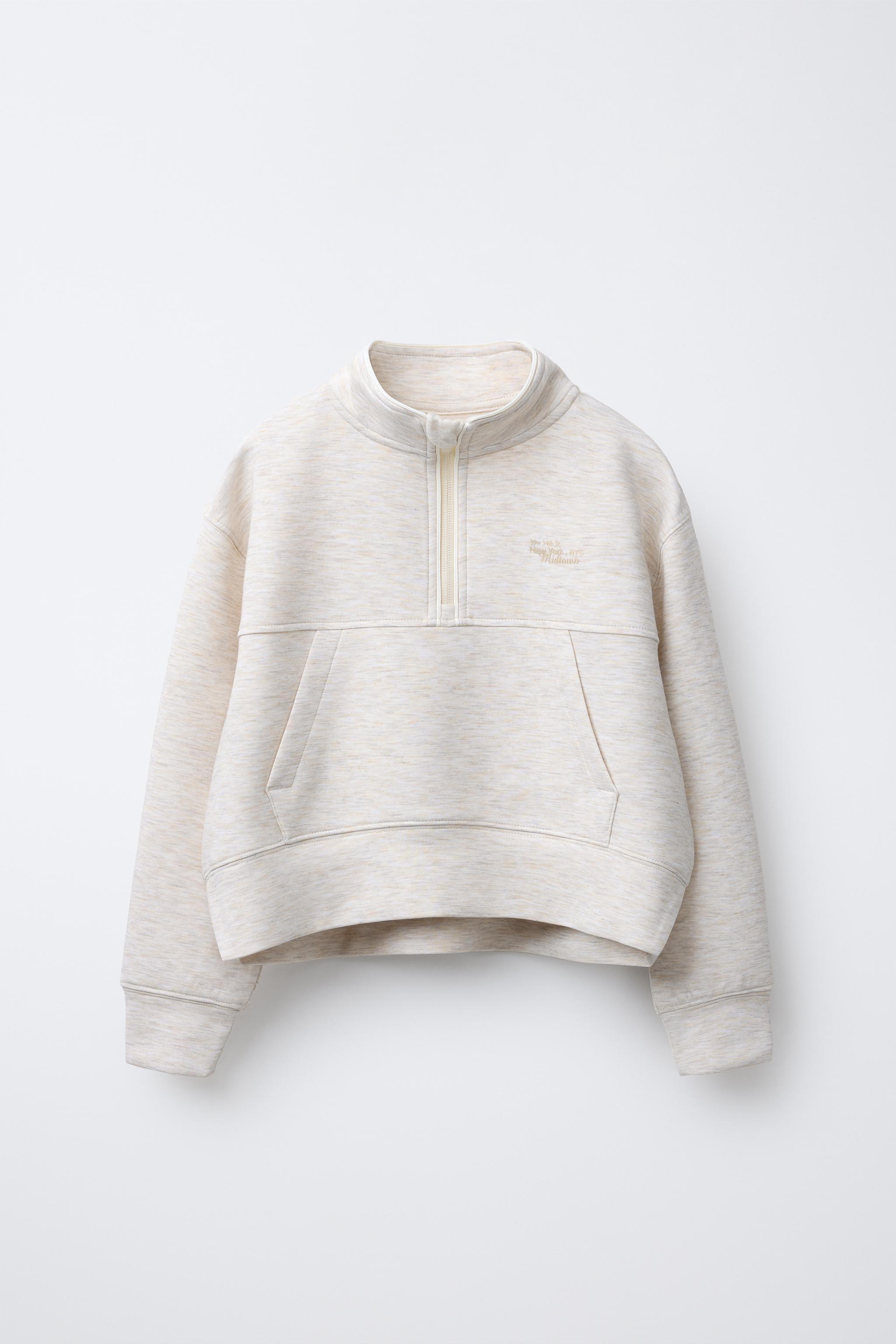 RAISED TEXT SWEATSHIRT